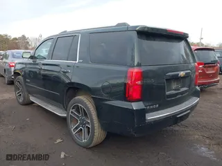2016 Chevrolet Tahoe LTZ with VIN 1GNSKCKC1GR297871, listed as a IAAI auction lot 41442380 with 91,354 mi miles. Bid and sale history available at carsss.com. Image 3.
