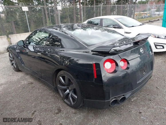 2009 Nissan GT-R Premium with VIN JN1AR54F19M252323, listed as a IAAI auction lot 41814114 with 98,972 mi miles. Bid and sale history available at carsss.com. Image 3.