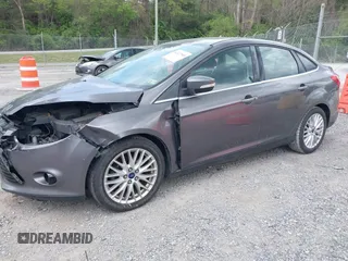 2013 Ford Focus Titanium with VIN 1FADP3J28DL225887, listed as a IAAI auction lot 42122968 with 139,248 mi miles and . Bid and sale history available at carsss.com. Image 2.