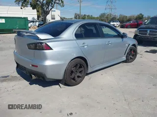 2013 Mitsubishi Lancer Evolution MR with VIN JA32W5FV6DU013470, listed as a IAAI auction lot 41544077 with 124,262 mi miles. Bid and sale history available at carsss.com. Image 4.