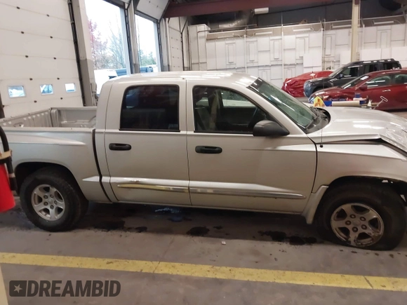 2005 Dodge Dakota Laramie with VIN 1D7HW58N75S188127, listed as a IAAI auction lot 41209206 with 117,480 mi miles and . Bid and sale history available at DreamBid. Image 14.
