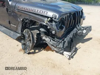 2021 Jeep Gladiator High Altitude z VIN 1C6HJTFG1ML597581, wystawiony jako IAAI lot #42191690 z przebiegiem 47 740 mil mil oraz . Historia ofert i sprzedaży dostępna na DreamBid. Obrazek 6.