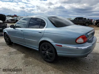 2005 Jaguar X-Type 3.0L with VIN SAJWA51AX5WE66748, listed as a Copart auction lot 49601374 with 129,709 mi miles and Salvage Title. Bid and sale history available at carsss.com. Image 2.