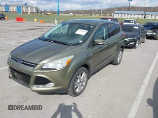 2013 Ford Escape SEL with VIN 1FMCU9H99DUC03956, listed as a IAAI auction lot 41891855 with 84,428 mi miles and . Bid and sale history available at DreamBid. Image 2.