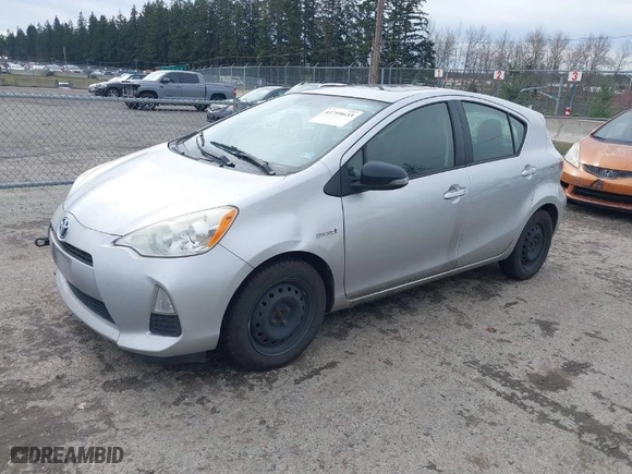 2013 Toyota Prius c One with VIN JTDKDTB32D1035449, listed as a IAAI auction lot 41799633 with 132,518 mi miles. Bid and sale history available at carsss.com. Image 2.