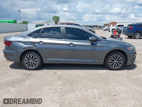 2019 Volkswagen Jetta S z VIN 3VWC57BUXKM061537, wystawiony jako IAAI lot #42170921 z przebiegiem 88 476 mil mil oraz . Historia ofert i sprzedaży dostępna na DreamBid. Obrazek 13.