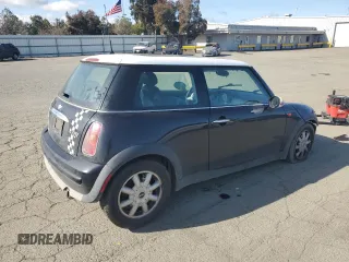 2004 MINI Hardtop with VIN WMWRC33464TJ62893, listed as a Copart auction lot 51905565 with 141,958 mi miles and Salvage Title. Bid and sale history available at DreamBid. Image 3.