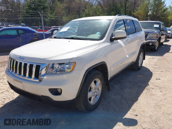 2011 Jeep Grand Cherokee Laredo with VIN 1J4RR4GG9BC556083, listed as a IAAI auction lot 42139453 with 145,623 mi miles and . Bid and sale history available at DreamBid. Image 2.