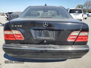 2000 Mercedes-Benz E-Class with VIN WDBJF70JXYB091085, listed as a Copart auction lot 77136484 with 185,429 mi miles and Salvage Title. Bid and sale history available at carsss.com. Image 6.