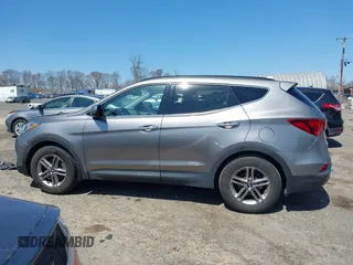 2017 Hyundai Santa Fe 2.4L z VIN 5NMZUDLB7HH015347, wystawiony jako IAAI lot #42035606 z przebiegiem 118 305 mil mil oraz . Historia ofert i sprzedaży dostępna na DreamBid. Obrazek 14.