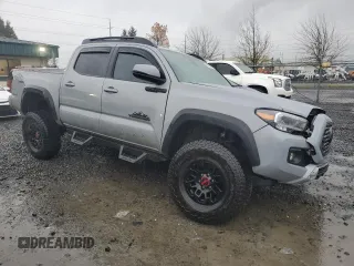 2021 Toyota Tacoma SR with VIN 3TMCZ5AN0MM395357, listed as a Copart auction lot 87086684 with 48,664 mi miles and Salvage title. Bid and sale history available at DreamBid. Image 4.