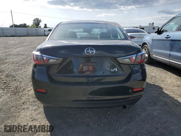 2016 Scion iA with VIN 3MYDLBZV0GY104038, listed as a Copart auction lot 51144605 with 58,624 mi miles and Salvage Title. Bid and sale history available at carsss.com. Image 6.