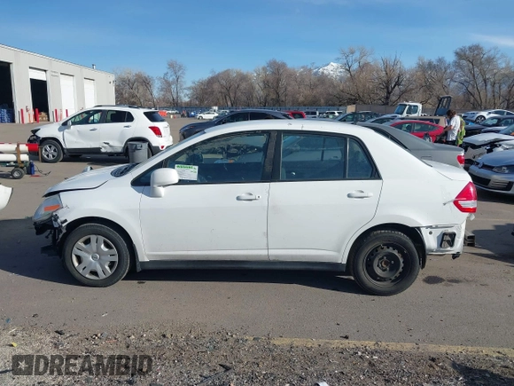 2010 Nissan Versa 1.8 S with VIN 3N1BC1AP8AL465537, listed as a IAAI auction lot 41762115 with 163,533 mi miles and . Bid and sale history available at carsss.com. Image 14.
