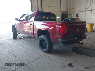 2018 Chevrolet Silverado 1500 LT with VIN 3GCUKREC0JG580317, listed as a IAAI auction lot 41868522 with 75,738 mi miles. Bid and sale history available at carsss.com. Image 3.
