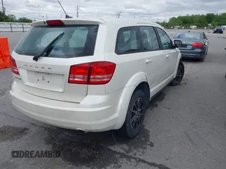2014 Dodge Journey SE with VIN 3C4PDCAB1ET192530, listed as a IAAI auction lot 41987728 with 186,486 mi miles and . Bid and sale history available at carsss.com. Image 4.