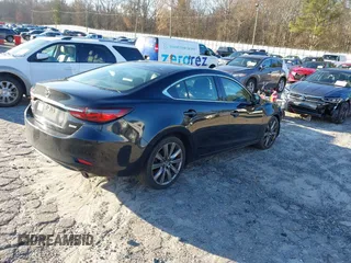 2018 Mazda Mazda6 Touring with VIN JM1GL1VM4J1307304, listed as a IAAI auction lot 41556563 with 173,739 mi miles. Bid and sale history available at carsss.com. Image 4.