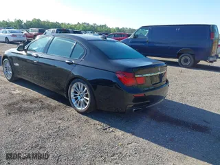 2015 BMW 7 Series 750Li with VIN WBAYE8C50FD781384, listed as a IAAI auction lot 42049829 with 128,087 mi miles. Bid and sale history available at carsss.com. Image 3.