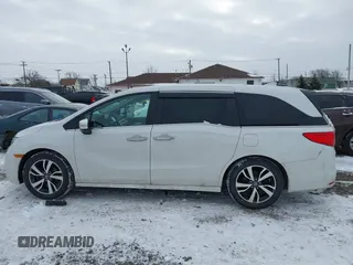 2023 Honda Odyssey Touring with VIN 5FNRL6H84PB048916, listed as a IAAI auction lot 41325052 with 50,290 mi miles and . Bid and sale history available at DreamBid. Image 14.