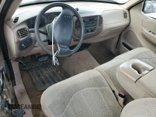 1999 Ford F-150 XL с VIN 1FTRF17L2XKA36749, выставлен на аукционе Copart как лот 84671444 с пробегом 148 338 миль миль и Списание • Salvage title. История ставок и продаж доступна на DreamBid. Изображение 8.