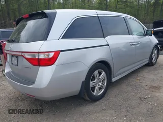 2012 Honda Odyssey Touring with VIN 5FNRL5H98CB026754, listed as a IAAI auction lot 41935562 with 165,626 mi miles. Bid and sale history available at carsss.com. Image 4.