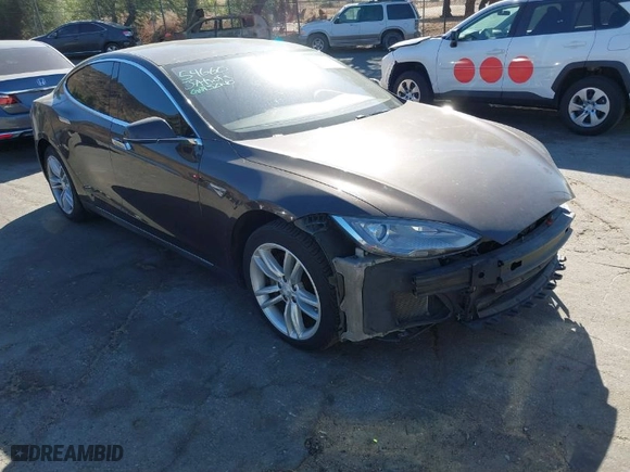 2013 Tesla Model S with VIN 5YJSA1DN4DFP19552, listed as a IAAI auction lot 41360466 with 129,806 mi miles. Bid and sale history available at carsss.com. Image 1.