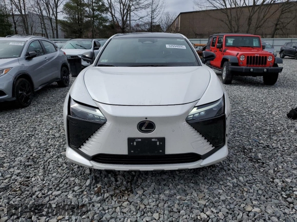 2024 Lexus RZ 450e Premium with VIN JTJAAAAB6RA024377, listed as a Copart auction lot 52694095 with 20,872 mi miles and Salvage title. Bid and sale history available at DreamBid. Image 5.