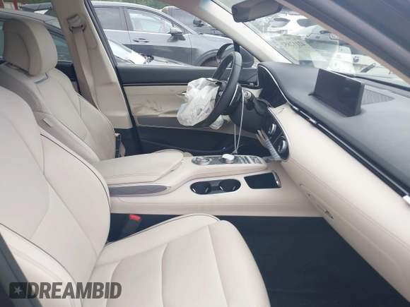 2023 Genesis GV70 2.5T z VIN KMUMADTB7PU103287, wystawiony jako IAAI lot #42112852 z przebiegiem 27 535 mil mil oraz . Historia ofert i sprzedaży dostępna na DreamBid. Obrazek 5.