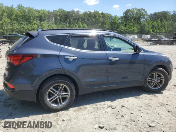 2017 Hyundai Santa Fe 2.4L z VIN 5NMZUDLB7HH028678, wystawiony jako Copart lot #57557855 z przebiegiem 102 049 mil mil oraz Szkoda całkowita • Salvage title. Historia ofert i sprzedaży dostępna na DreamBid. Obrazek 3.