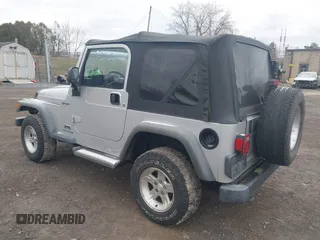 2004 Jeep Wrangler Sport with VIN 1J4FA49S64P749380, listed as a IAAI auction lot 41935405 with 84,690 mi miles. Bid and sale history available at carsss.com. Image 3.