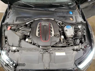2016 Audi S6 Prestige z VIN WAUH2AFC4GN096343, wystawiony jako Copart lot #68166002 z przebiegiem 111 836 mil mil oraz . Historia ofert i sprzedaży dostępna na DreamBid. Obrazek 13.