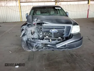 2005 Ford F-150 STX with VIN 1FTRX12W25NA37703, listed as a Copart auction lot 60089325 with 128,651 mi miles and Salvage title. Bid and sale history available at DreamBid. Image 13.