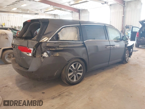 2014 Honda Odyssey Touring with VIN 5FNRL5H99EB105059, listed as a IAAI auction lot 42457672 with 240,581 mi miles and . Bid and sale history available at DreamBid. Image 4.