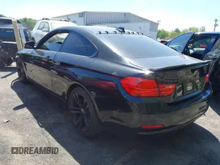 2015 BMW 4 Series 428i with VIN WBA3N7C54FK223490, listed as a IAAI auction lot 42033200 with 145,882 mi miles. Bid and sale history available at carsss.com. Image 3.