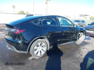 2023 Tesla Model Y Long Range with VIN 7SAYGDEE8PA151965, listed as a IAAI auction lot 41343497 with 25,869 mi miles. Bid and sale history available at carsss.com. Image 4.
