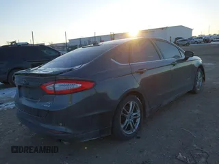 2015 Ford Fusion SE Hybrid with VIN 3FA6P0LU1FR219908, listed as a IAAI auction lot 41272688 with 310,452 mi miles. Bid and sale history available at carsss.com. Image 4.