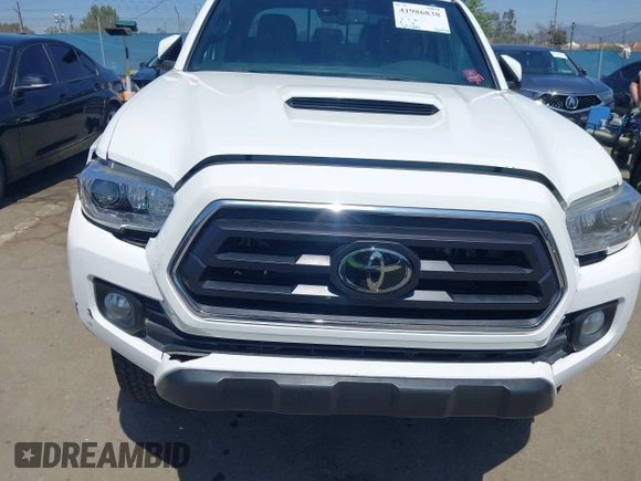 2021 Toyota Tacoma 4WD SR5 with VIN 3TMDZ5BN4MM106693, listed as a IAAI auction lot 41986838 with 52,510 mi miles. Bid and sale history available at carsss.com. Image 6.
