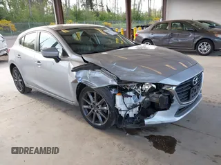 2018 Mazda 3 Touring z VIN 3MZBN1L37JM201797, wystawiony jako IAAI lot #42258756 z przebiegiem 80 593 mil mil oraz . Historia ofert i sprzedaży dostępna na DreamBid. Obrazek 1.