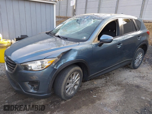 2016 Mazda CX-5 Touring with VIN JM3KE4CY5G0771252, listed as a IAAI auction lot 42138637 with 106,767 mi miles and . Bid and sale history available at carsss.com. Image 2.