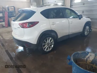 2013 Mazda CX-5 Grand Touring with VIN JM3KE4DE1D0159632, listed as a IAAI auction lot 41524272 with 99,479 mi miles. Bid and sale history available at carsss.com. Image 4.