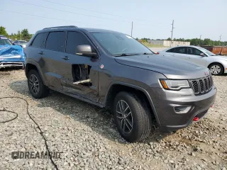 2017 Jeep Grand Cherokee Trailhawk with VIN 1C4RJFLT3HC614449, listed as a Copart auction lot 58559335 with 153,051 mi miles and Salvage title. Bid and sale history available at DreamBid. Image 4.