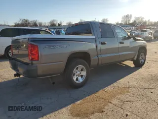 2008 Dodge Dakota SXT z VIN 1D7HW38K48S525576, wystawiony jako Copart lot #84548714 z przebiegiem 107 841 mil mil oraz Szkoda całkowita • Salvage title. Historia ofert i sprzedaży dostępna na DreamBid. Obrazek 3.