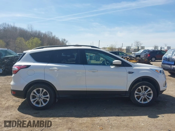 2018 Ford Escape SE z VIN 1FMCU9GD4JUB06181, wystawiony jako IAAI lot #42046708 z przebiegiem 160 987 mil mil oraz . Historia ofert i sprzedaży dostępna na DreamBid. Obrazek 14.