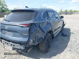 2022 Mazda CX-9 Grand Touring with VIN JM3TCBDY8N0628886, listed as a IAAI auction lot 42074044 with 67,867 mi miles and . Bid and sale history available at DreamBid. Image 4.