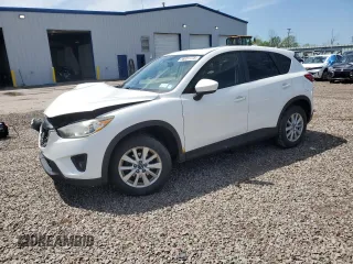 2014 Mazda CX-5 Touring z VIN JM3KE4CY7E0343941, wystawiony jako Copart lot #56851775 z przebiegiem 156 204 mil mil oraz Szkody całkowita. Historia ofert i sprzedaży dostępna na DreamBid. Obrazek 1.