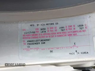 2001 Kia Rio with VIN KNADC123716042067, listed as a IAAI auction lot 41449479 with 113,108 mi miles. Bid and sale history available at carsss.com. Image 9.