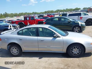 2004 Oldsmobile Alero GL1 z VIN 1G3NL52F54C206964, wystawiony jako IAAI lot #42160307 z przebiegiem 129 808 mil mil oraz . Historia ofert i sprzedaży dostępna na DreamBid. Obrazek 13.