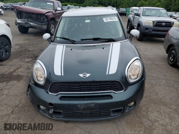 2014 MINI Countryman S with VIN WMWZC5C58EWP39797, listed as a Copart auction lot 62193515 with 84,989 mi miles and Salvage title. Bid and sale history available at DreamBid. Image 5.