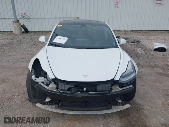2019 Tesla Model 3 Mid Range with VIN 5YJ3E1EA8KF472540, listed as a IAAI auction lot 41661312 with 75,575 mi miles and . Bid and sale history available at DreamBid. Image 13.