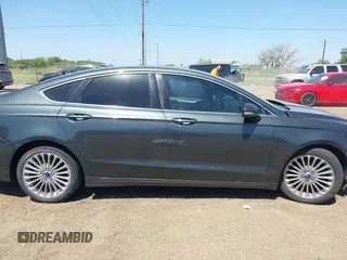 2016 Ford Fusion Titanium with VIN 3FA6P0K98GR158877, listed as a IAAI auction lot 41994013 with 57,027 mi miles and . Bid and sale history available at DreamBid. Image 14.