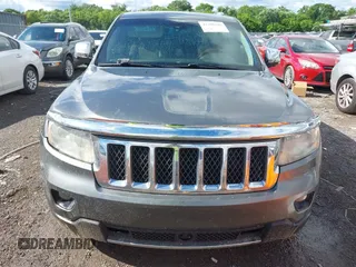2011 Jeep Grand Cherokee Overland Summit with VIN 1J4RR6GT3BC713812, listed as a IAAI auction lot 42398585 with 208,476 mi miles and . Bid and sale history available at DreamBid. Image 12.